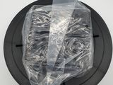 a close up of a plastic bag sitting on top of a stove