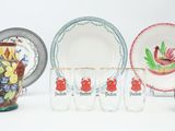 many different types of dishes and cups on the table