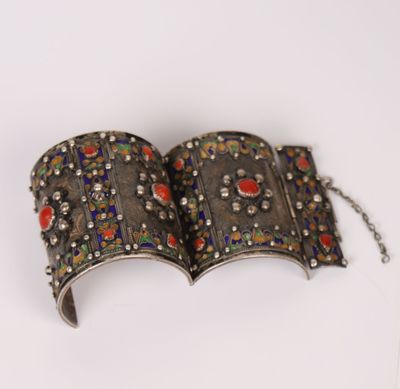 an open book with a chain around it sitting on top of a table