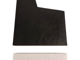 an image of a piece of black paper on a white surface