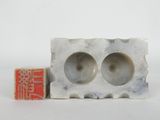 an image of a couple of cement blocks sitting next to each other