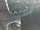 a dashboard of a car with a radio and a steering wheel