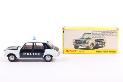 a toy police car next to a boxed box