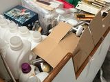 a large box full of bottles and containers in a room