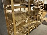 a room with a lot of wood on the shelves