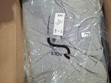 a box with a shirt inside of it that is wrapped in plastic