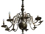 a close up of a chandelier with candles on it
