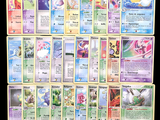 a lot of pokemon cards that are on the table