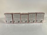 four boxes of soap sitting on top of a table