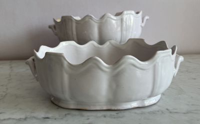 two white bowls sitting on a marble counter top