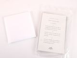 a small piece of paper sitting on top of a white table