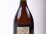 a bottle of wine that is sitting on a table