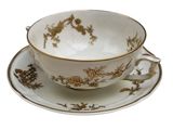 a tea cup and saucer on a saucer
