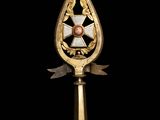a close up of a metal object with a cross on it