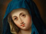 a painting of a woman with a blue veil on her head