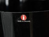 a close up of a glass with a red sticker on it