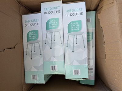 three boxes of toilet paper sitting on top of a cardboard box