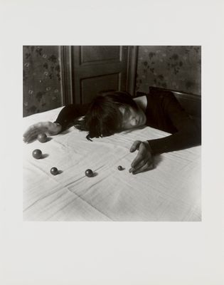 a black and white photo of a person laying on a bed