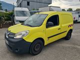 yellow van parked in a parking lot with other vehicles in the background