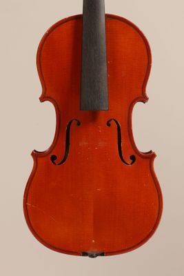 an old violin with a bow hanging from it ' s back