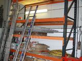 many shelves that have ladders in them in a garage
