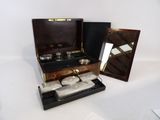a small wooden box with a mirror and a mirror in it