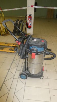 a vacuum that is sitting on the floor in the room