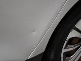 a close up of a car ' s tire on the ground