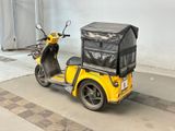 a scooter with a box on the back of it