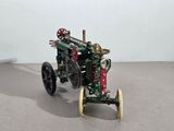 a small toy tractor that is sitting on a table