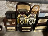 a lot of old radio ' s sitting on top of each other