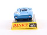 a blue toy car sitting on top of a yellow box
