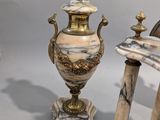 two vases sitting next to each other on a table