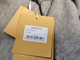 a tag on a sweater that says cold weather