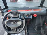 a small car with a steering wheel and a dash board