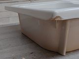 a bath tub that is sitting in the middle of the floor