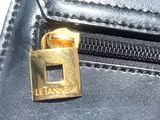 a close up of a purse with a lock on it