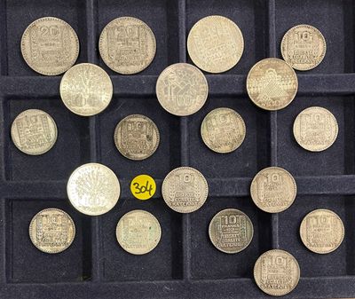 a lot of coins that are in a black case