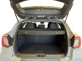 the back of a car with its trunk open and the back seats folded down