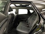 a black car with its doors open in the back of the car