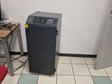 a small room with a computer and a printer on the floor