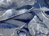 a drawing of a fish on the sand with a pair of scissors