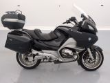 a picture of a black and silver motorcycle parked in a room