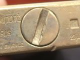 a gold bar that is being held in someone ' s hand