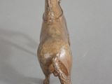 a small statue of a horse on a table