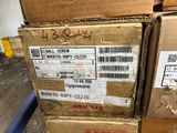 a stack of boxes sitting on top of a blue carton