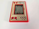 a small red gameboy sitting on a white surface