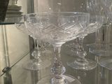 a glass table with a lot of wine glasses on it