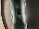 a toilet in the middle of a metal container