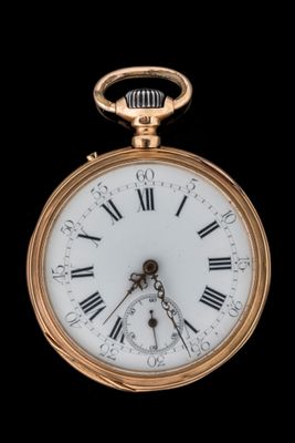 a gold pocket watch with roman numerals on it